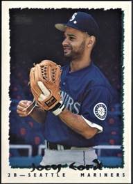 A baseball player holding a ball

Description automatically generated with medium confidence