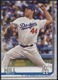 A baseball player throwing a ball

Description automatically generated