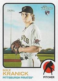 A baseball player holding a glove

Description automatically generated