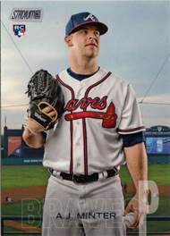 A baseball player holding a glove

Description automatically generated